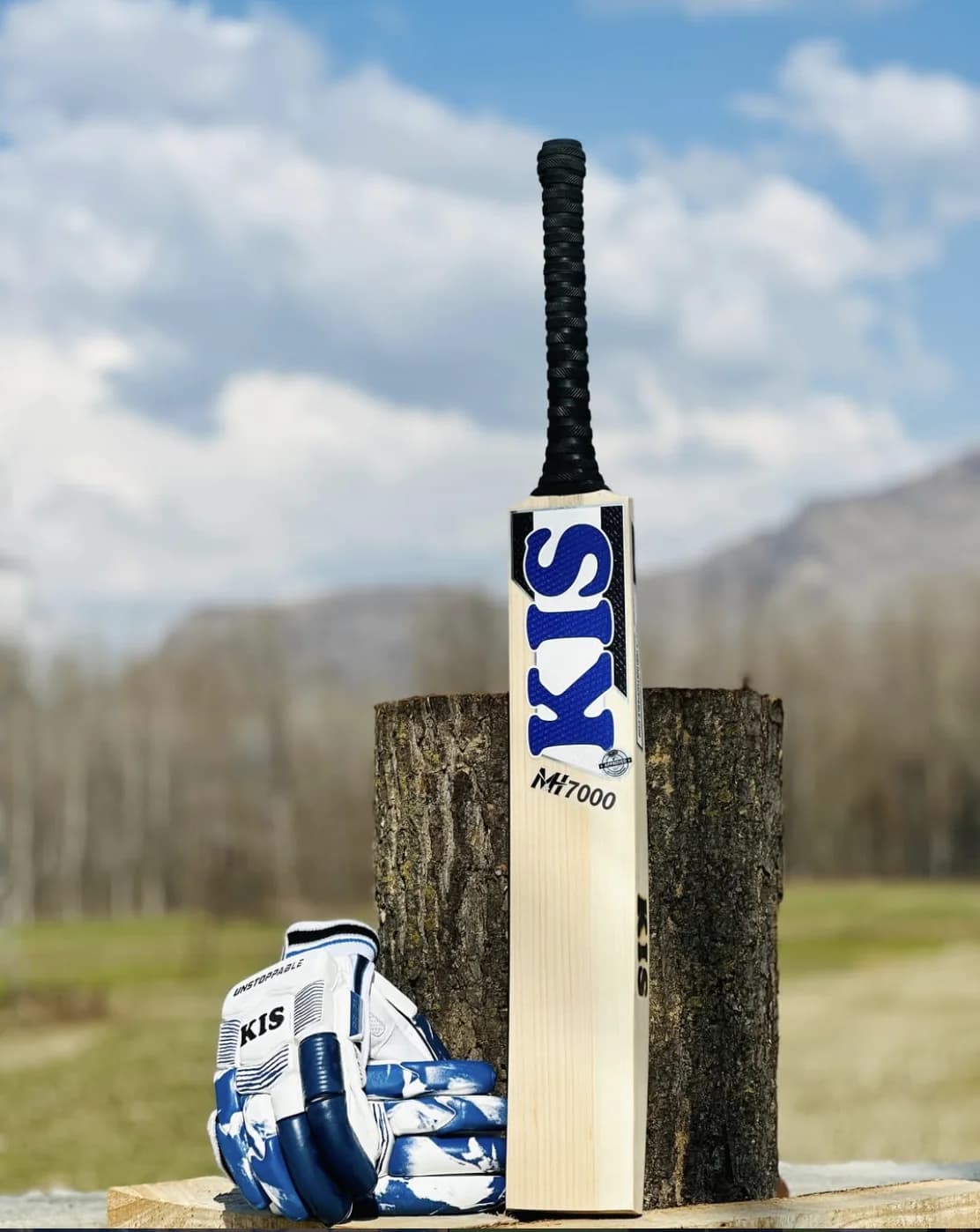 A KIS M&H 7000 in the blue decal with matching KIS batting gloves, shot outdoors in Kashmir