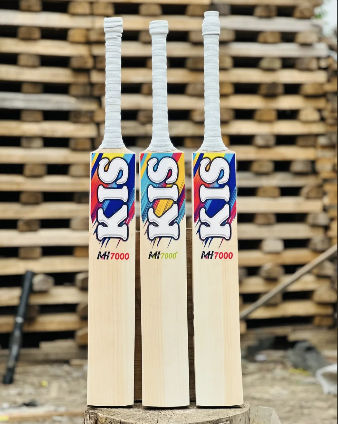 Three KIS M&H 7000 bats in the full-colour decal at the KIS workshop